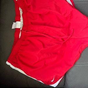 Red and white women’s nike shorts.(XL)